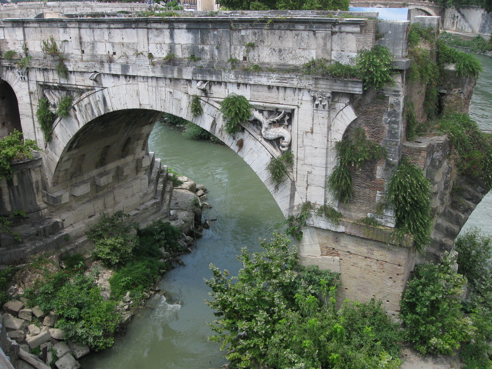 Ancient bridge section over Tiber River, Rome, Italy